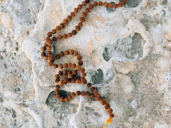 Silhouette of a person stretching against a sunrise, feeling light and free.